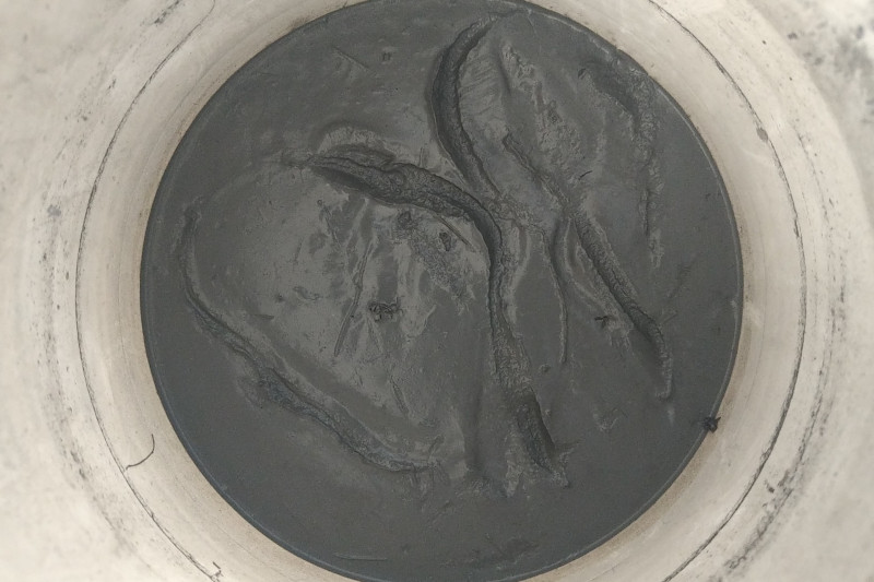 slate mud in a bucket