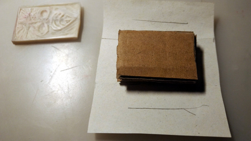 wrapping paper around cardboard